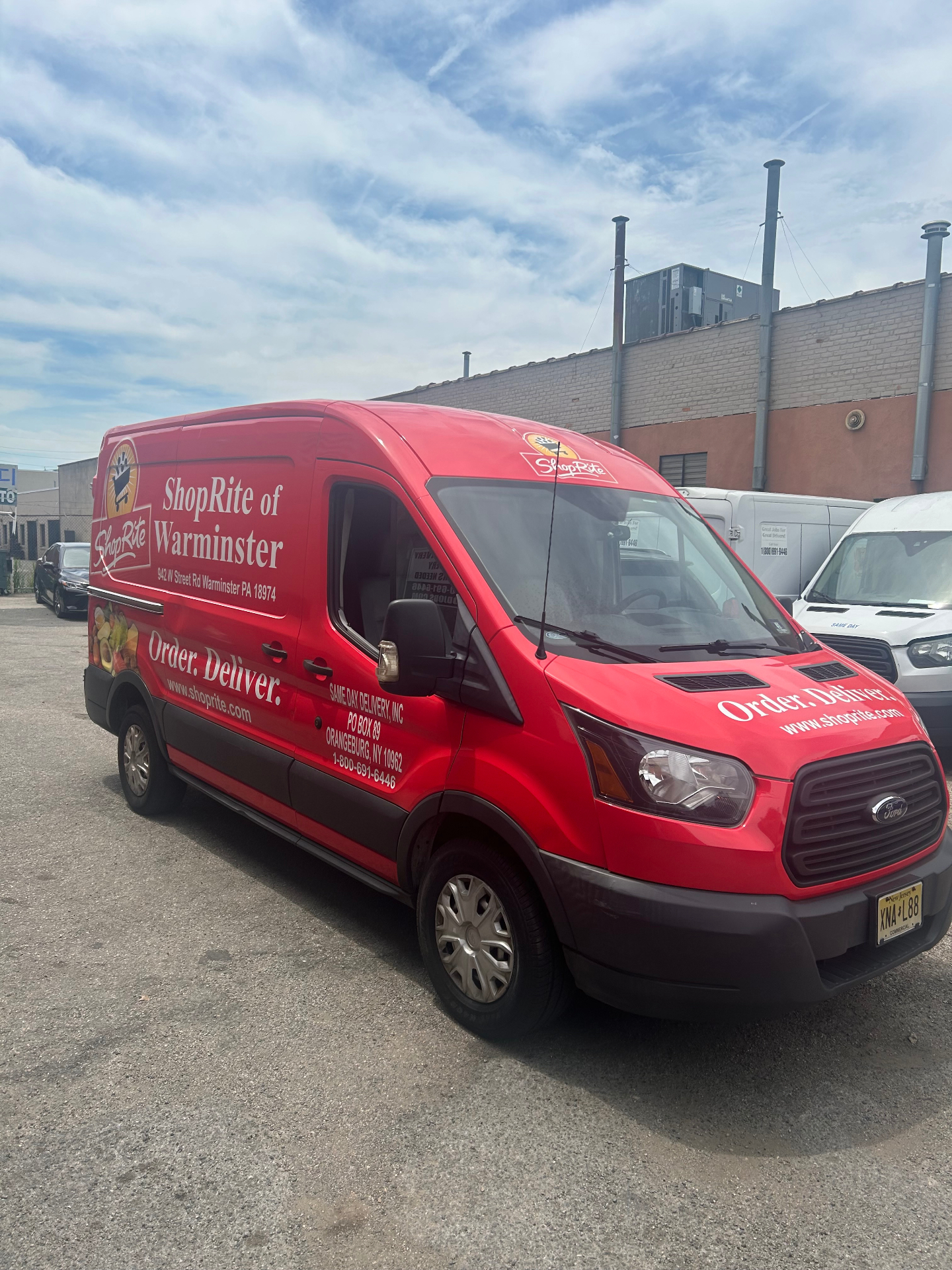 SameDay Delivery van parked alongside the fleet